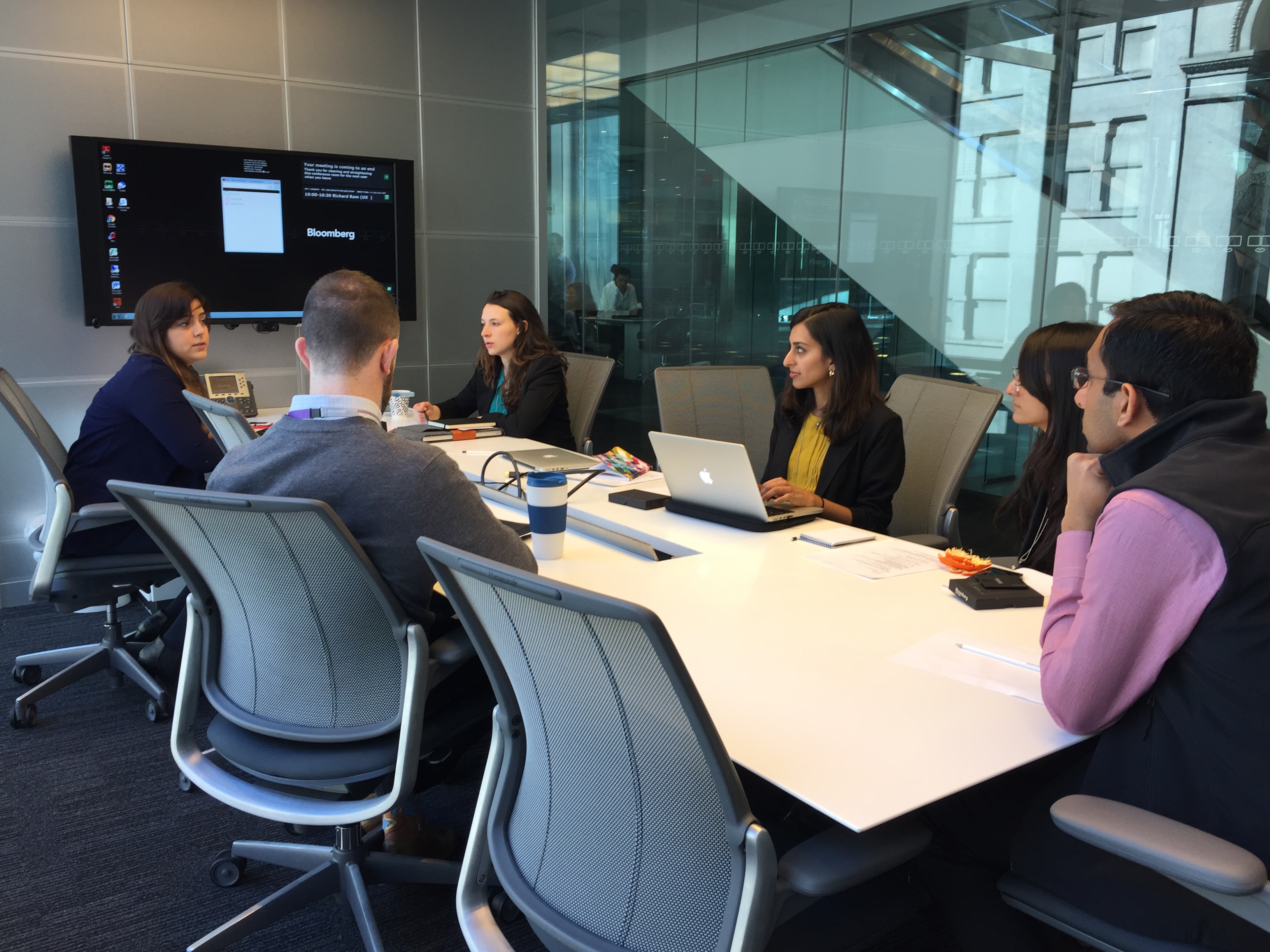 Team conducting interview with stakeholders at Bloomberg.